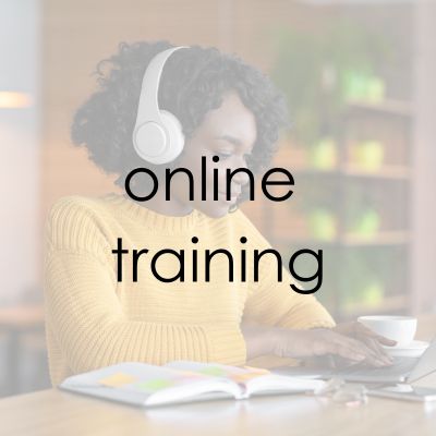 A woman reading a textbook with the words Online Training overlayed